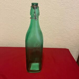 Tall green glass bottle